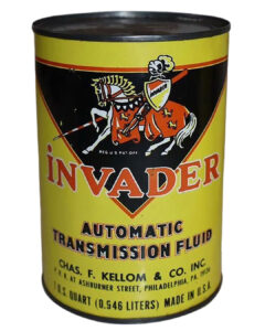 Invader ATF (Automatic Transmission Fluid) One Quart Metal Oil Can. Bright yellow round yellow oil can. Black triangle on top half with graphic Invader knight on horse logo on top. Black lettering underneath. Chas. F. Kellom & Co. Inc.