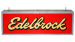 Edelbrock Large Lighted Plastic Dealership Sign. Large, rectangular sign. Red with “Edelbrock” written in cursive yellow letters which turn white when the sign lights up.