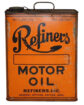 Refiners Slim 1 Gallon Oil Can. A slim orange oil can with “Refiners MOTOR OIL” written in large black letters across the can. “REFINERS, INC” is written across the bottom with “GENERAL OFFICES, DAYTON, OHIO” written below. Some wear and rust.