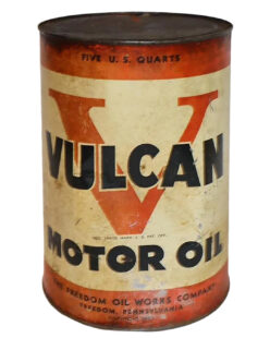 Freedom Oil Vulcan Metal 5 Quart Oil Can. Beige and red can with discoloration and rust on the top. “VULCAN MOTOR OIL” is written across the can in large black letters over a red V. “THE FREEDOM OIL WORKS COMPANY” and “FREEDOM, PENNSYLVANIA” is written in small black letters with “Copyright 1937” underneath this at the very bottom.