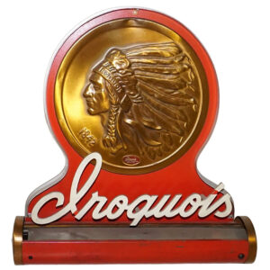 Iroquois Brewing Co. of Buffalo, NY Lighted Backbar Sign – rare! Red sign featuring a large Indian Chief graphic embossed in gold tin followed by “Iroquois” in white, cursive letters sitting atop a bottom light.