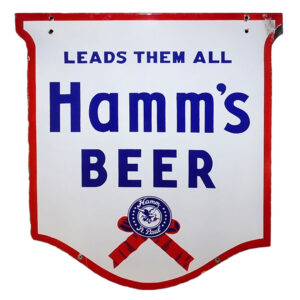Hamm’s Large Double-Sided Porcelain “Leads them all Shield” Outdoor Sign – wow! White sign with red border and blue lettering. “LEADS THEM ALL” is written across the top with “Hamm’s Beer” written below. A blue and red ribbon is featured at the bottom with “Hamm St.Paul” written around an eagle graphic.