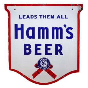 Hamm’s Large Double-Sided Porcelain “Leads them all Shield” Outdoor Sign – wow! White sign with red border and blue lettering. “LEADS THEM ALL” is written across the top with “Hamm’s Beer” written below. A blue and red ribbon is featured at the bottom with “Hamm St.Paul” written around an eagle graphic.